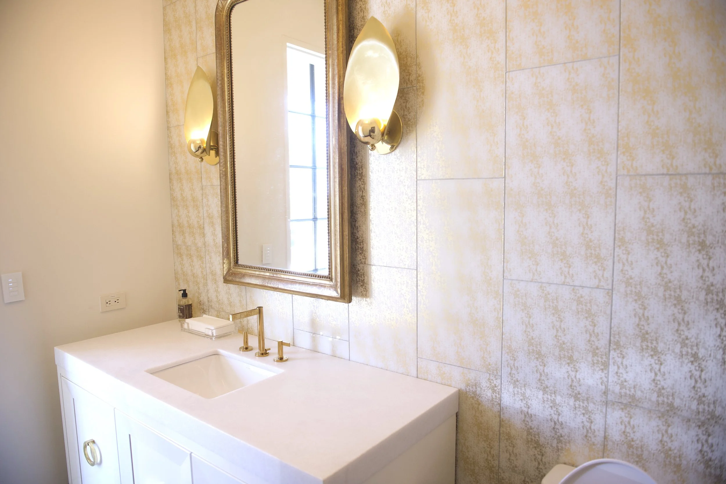 Wall tile in gold-finish bathroom, Austin